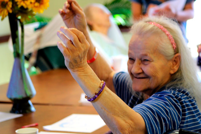 An elderly woman enjoying the presence of East Leyden students at Elmwood Care in Elmwood Park. 