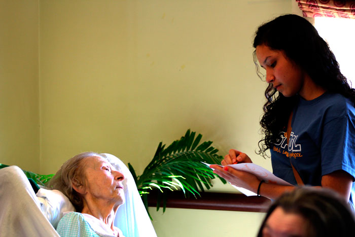 East Leyden student drawing a picture for an elderly woman at Elmwood Care in Elmwood Park, Illinois. 