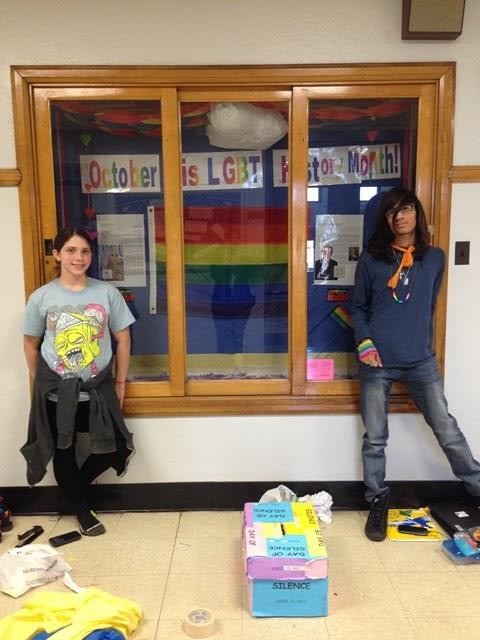 On Common Ground members show off their Ally Week display case.