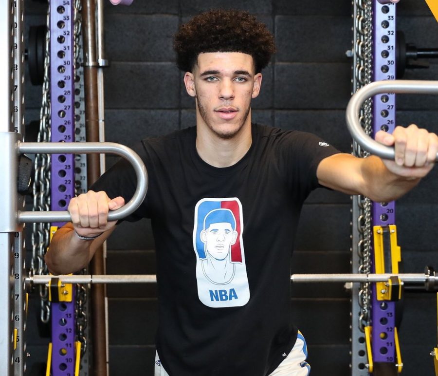 Lonzo Ball wearing a shirt that has him pictured as “the face” of the NBA.